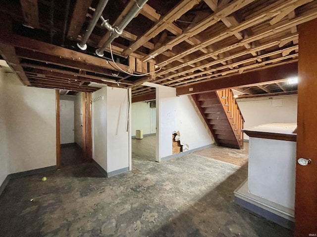 5425 Lincoln Ave, Evansville, IN 47715 - below grade area with stairway and baseboards