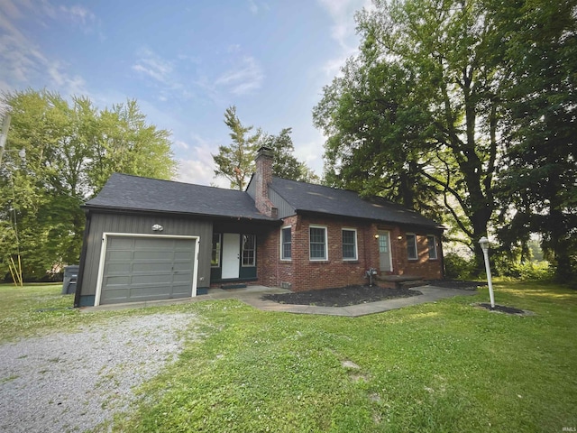 5425 Lincoln Ave, Evansville, IN 47715 - ranch-style home featuring driveway, a garage, a chimney, and a front yard