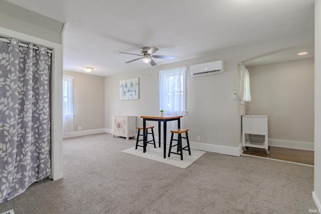 8694 W 1000 S Unit 35, Lafontaine, IN 46940 - dining room with a wall mounted air conditioner, a ceiling fan, healthy amount of natural light, and baseboards