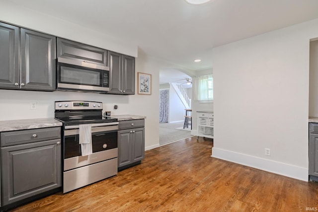8694 W 1000 S Unit 35, Lafontaine, IN 46940 - kitchen featuring stainless steel appliances, gray cabinetry, light countertops, baseboards, and recessed lighting