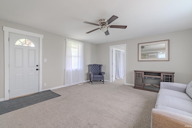 8694 W 1000 S Unit 35, Lafontaine, IN 46940 - entrance foyer with ceiling fan, baseboards, and carpet