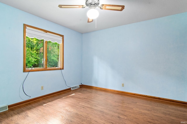 2299 Brown Chapel Rd, Boonville, IN 47601 - spare room featuring wood finished floors, baseboards, and ceiling fan