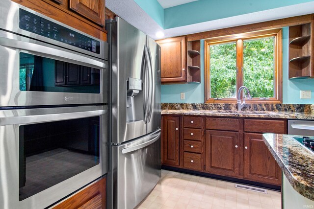 2299 Brown Chapel Rd, Boonville, IN 47601 - kitchen featuring stainless steel appliances, open shelves, a sink, and dark stone countertops