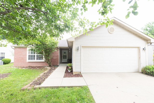 5530 W Cobblestone St, Bloomington, IN 47403 - ranch-style house with driveway, a garage, a front yard, and brick siding