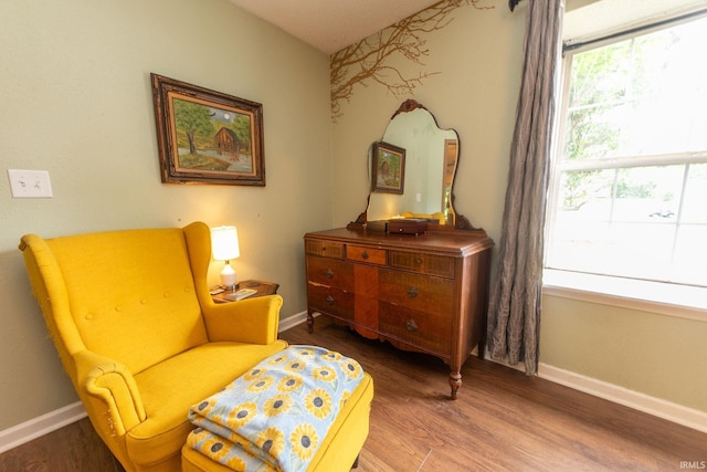 5530 W Cobblestone St, Bloomington, IN 47403 - sitting room with wood finished floors and baseboards
