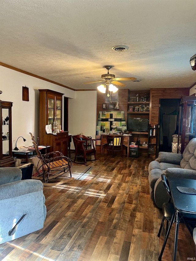 3559 W County Road 775 N, Orleans, IN 47452 - living room featuring wood finished floors, ceiling fan, ornamental molding, and a textured ceiling