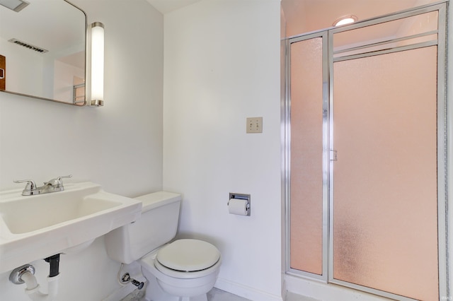 50 Reindeer Cir, Santa Claus, IN 47579 - bathroom featuring toilet, baseboards, and a stall shower