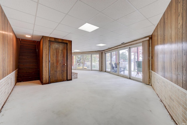 50 Reindeer Cir, Santa Claus, IN 47579 - unfurnished room featuring wooden walls and a drop ceiling