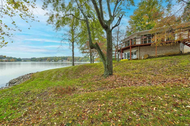 50 Reindeer Cir, Santa Claus, IN 47579 - view of green lawn with a deck with water view