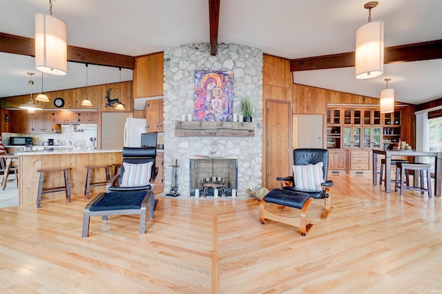50 Reindeer Cir, Santa Claus, IN 47579 - living area featuring wooden walls, light wood finished floors, and a fireplace