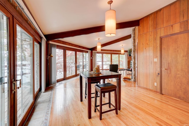 50 Reindeer Cir, Santa Claus, IN 47579 - dining area featuring light wood-type flooring, wooden walls, and french doors