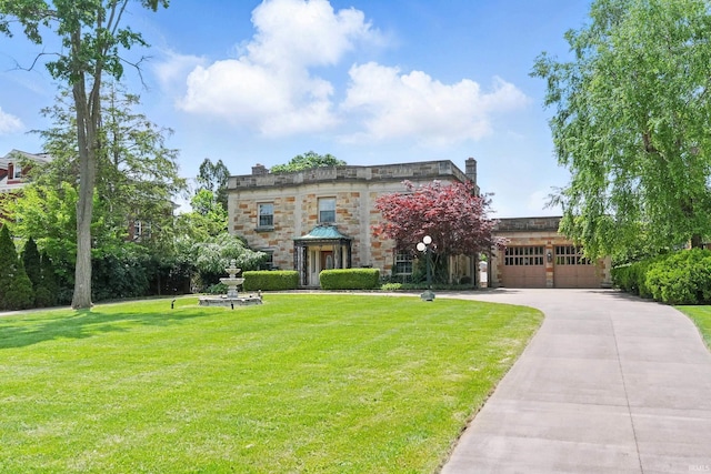 2307 Forest Park Blvd, Fort Wayne, IN 46805 - view of front of property with a front yard, stone siding, concrete driveway, and an attached garage