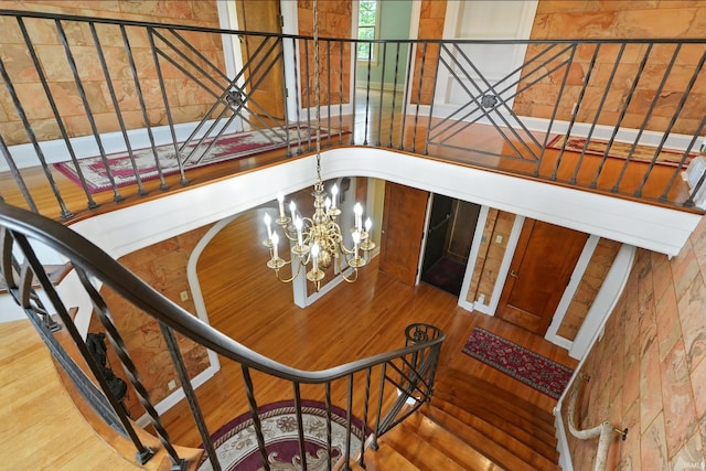 2307 Forest Park Blvd, Fort Wayne, IN 46805 - stairs with a chandelier and wood finished floors