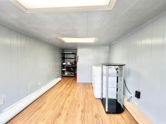 83 9th St, Logansport, IN 46947 - basement with washer and clothes dryer, wood finished floors, and baseboard heating