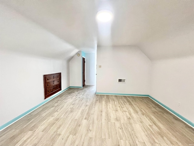 83 9th St, Logansport, IN 46947 - additional living space featuring lofted ceiling, light wood-type flooring, and baseboards