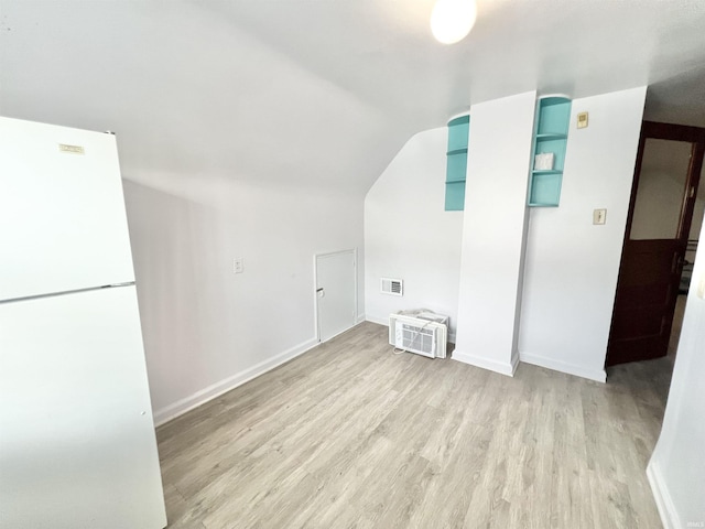 83 9th St, Logansport, IN 46947 - bonus room featuring light wood-style floors, lofted ceiling, and baseboards