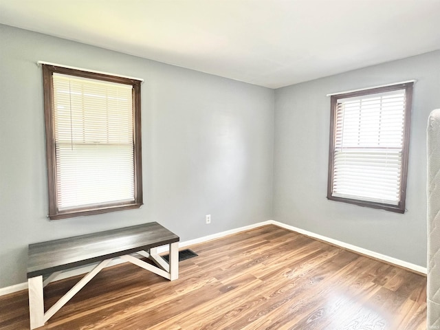 83 9th St, Logansport, IN 46947 - spare room featuring baseboards and wood finished floors