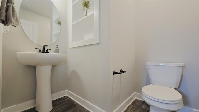 916 Cameo Dr, Evansville, IN 47711 - bathroom with baseboards, toilet, and wood finished floors