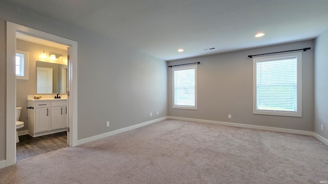916 Cameo Dr, Evansville, IN 47711 - unfurnished bedroom with carpet flooring, baseboards, recessed lighting, a sink, and ensuite bathroom