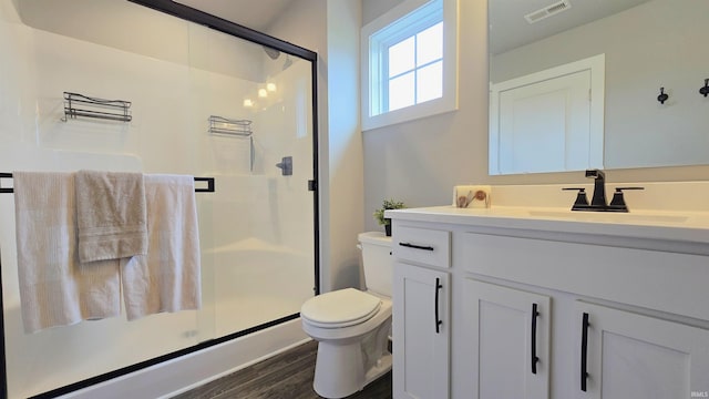 916 Cameo Dr, Evansville, IN 47711 - bathroom featuring toilet, vanity, a shower stall, and wood finished floors