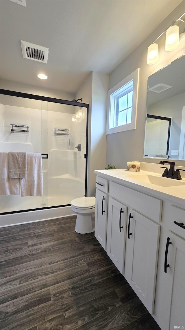 916 Cameo Dr, Evansville, IN 47711 - full bathroom featuring a shower stall, vanity, toilet, wood finished floors, and recessed lighting