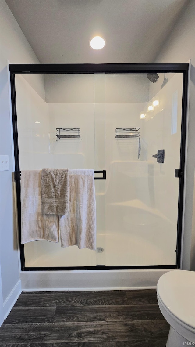 916 Cameo Dr, Evansville, IN 47711 - full bath with a shower stall, wood finished floors, toilet, baseboards, and recessed lighting