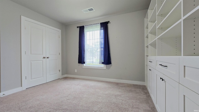 916 Cameo Dr, Evansville, IN 47711 - unfurnished bedroom with multiple windows, light carpet, baseboards, and a closet