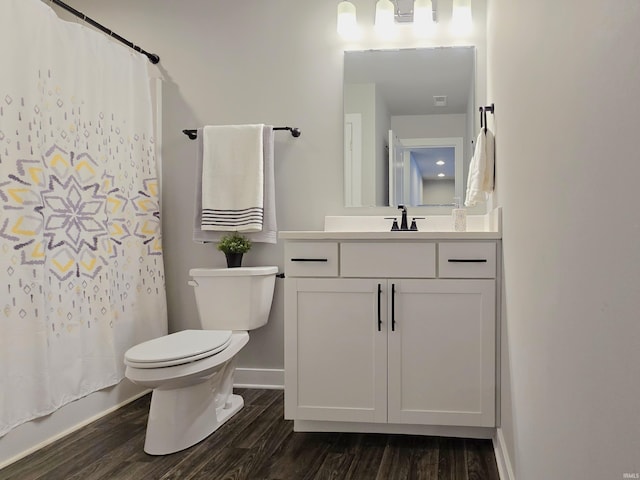 916 Cameo Dr, Evansville, IN 47711 - bathroom with wood finished floors, toilet, vanity, and baseboards