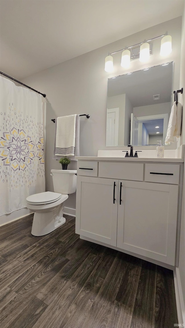 916 Cameo Dr, Evansville, IN 47711 - full bathroom featuring toilet, wood finished floors, vanity, and curtained shower