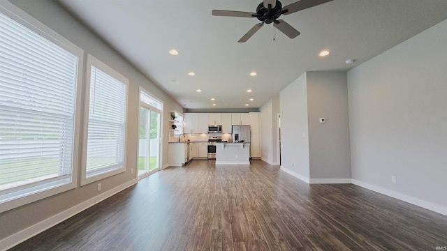916 Cameo Dr, Evansville, IN 47711 - unfurnished living room with recessed lighting, dark wood-style floors, ceiling fan, a sink, and baseboards
