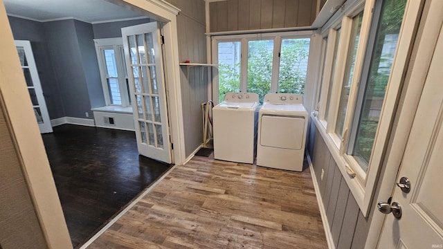 106 N 21st St, Terre Haute, IN 47807 - laundry room with washer and clothes dryer, wood finished floors, crown molding, baseboards, and wood walls