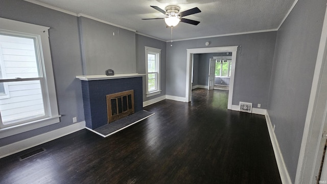 106 N 21st St, Terre Haute, IN 47807 - unfurnished living room featuring wood finished floors, ceiling fan, crown molding, a fireplace, and baseboards
