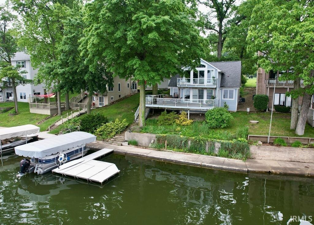 306 Spring Beach Rd, Rome City, IN 46784 - dock area with a water view and a yard