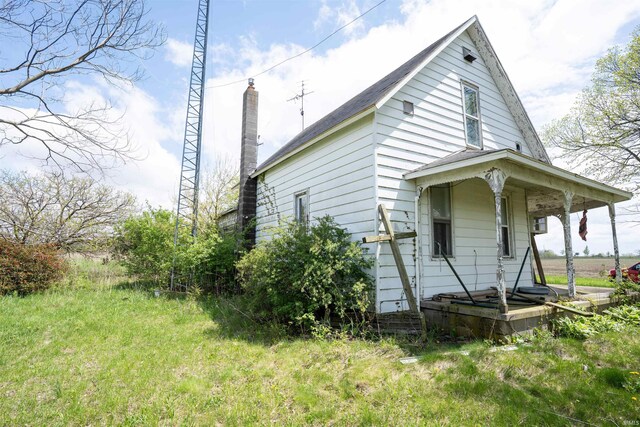 9529 N 600 E, North Manchester, IN 46962 - view of side of home featuring covered porch and a chimney