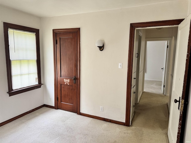 539 Goshen Ave, Elkhart, IN 46516 - unfurnished bedroom featuring light carpet and baseboards