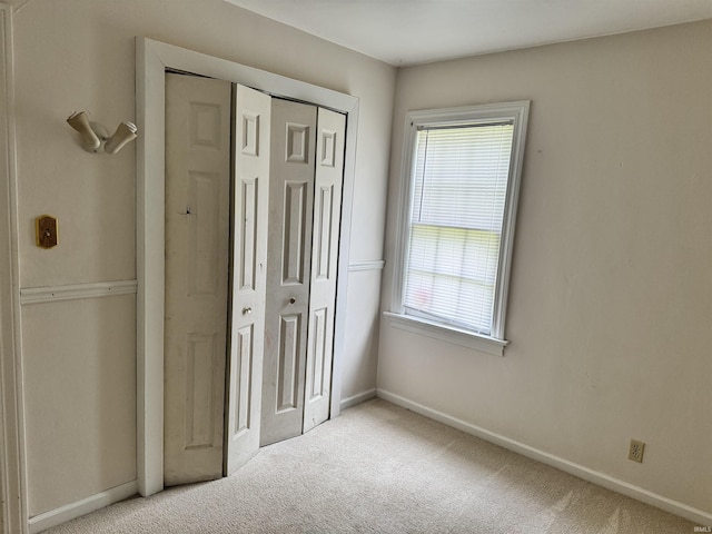 539 Goshen Ave, Elkhart, IN 46516 - unfurnished bedroom featuring carpet, baseboards, and a closet