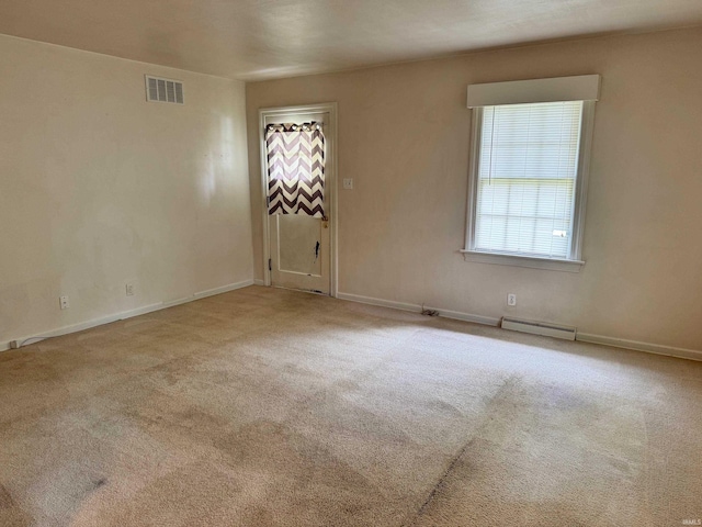 539 Goshen Ave, Elkhart, IN 46516 - spare room featuring baseboard heating, carpet floors, and baseboards