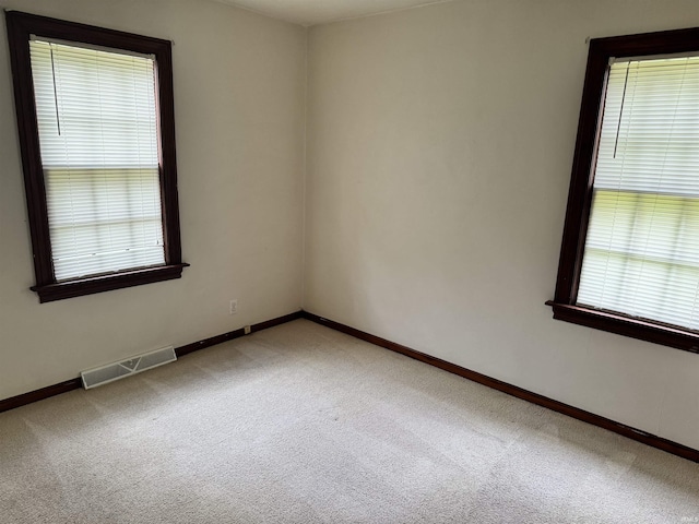 539 Goshen Ave, Elkhart, IN 46516 - unfurnished room with light colored carpet and baseboards