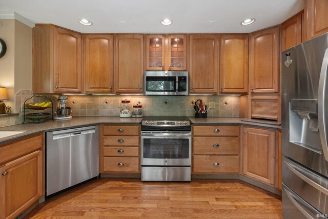 3709 Capilano Dr, West Lafayette, IN 47906 - kitchen featuring appliances with stainless steel finishes, brown cabinetry, and recessed lighting