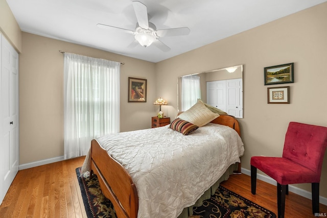 3709 Capilano Dr, West Lafayette, IN 47906 - bedroom with a closet, baseboards, light wood finished floors, and a ceiling fan