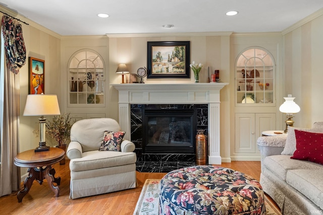 3709 Capilano Dr, West Lafayette, IN 47906 - living area featuring wood finished floors, a high end fireplace, crown molding, and recessed lighting