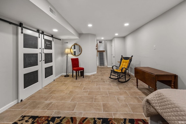 3709 Capilano Dr, West Lafayette, IN 47906 - sitting room featuring a barn door, recessed lighting, and baseboards