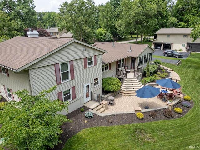 3709 Capilano Dr, West Lafayette, IN 47906 - rear view of property with a patio, a lawn, a wooden deck, and stairs