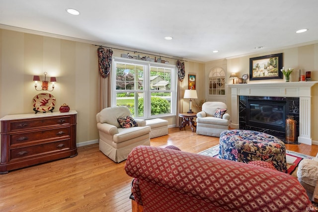 3709 Capilano Dr, West Lafayette, IN 47906 - living room featuring ornamental molding, light wood-style floors, a high end fireplace, baseboards, and recessed lighting