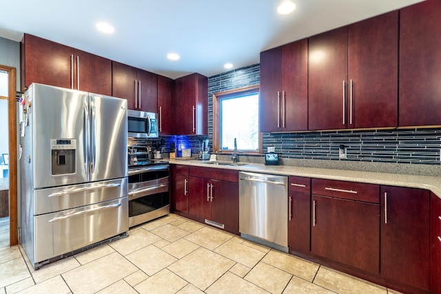 10909 Bittersweet Dells Ln, Fort Wayne, IN 46814 - kitchen with stainless steel appliances, a sink, dark brown cabinets, decorative backsplash, and recessed lighting