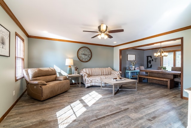 10909 Bittersweet Dells Ln, Fort Wayne, IN 46814 - living room with wood finished floors, baseboards, ornamental molding, ceiling fan, and a chandelier