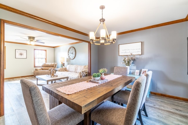 10909 Bittersweet Dells Ln, Fort Wayne, IN 46814 - dining room with a chandelier, baseboards, ornamental molding, and light wood-type flooring
