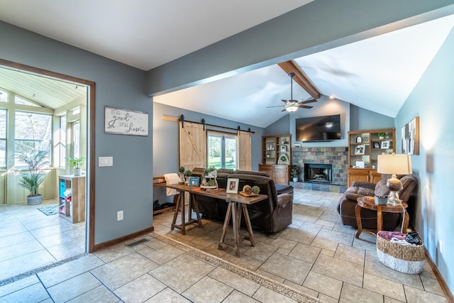 10909 Bittersweet Dells Ln, Fort Wayne, IN 46814 - living area with a barn door, a ceiling fan, baseboards, and a fireplace with raised hearth