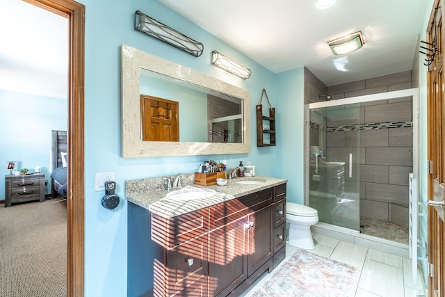 10909 Bittersweet Dells Ln, Fort Wayne, IN 46814 - ensuite bathroom featuring a stall shower, double vanity, and toilet