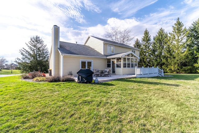 10909 Bittersweet Dells Ln, Fort Wayne, IN 46814 - back of house with a sunroom, a chimney, and a yard
